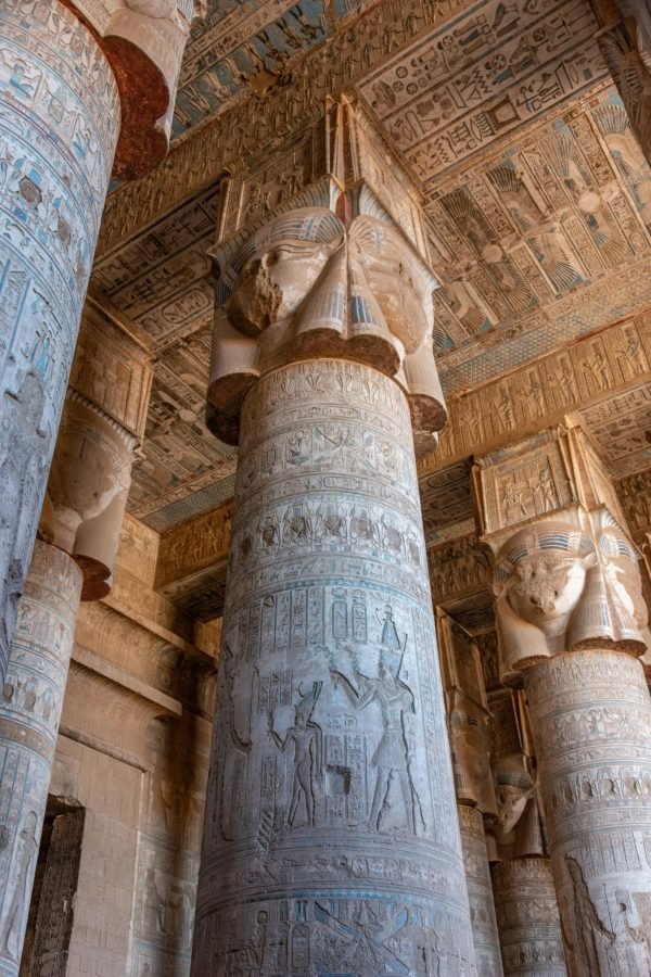 Detailed view of ancient Egyptian temple columns with hieroglyphics and carvings at Luxor.