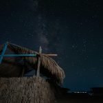 A serene night sky filled with stars over a rustic hut in Marsa Alam, Egypt.